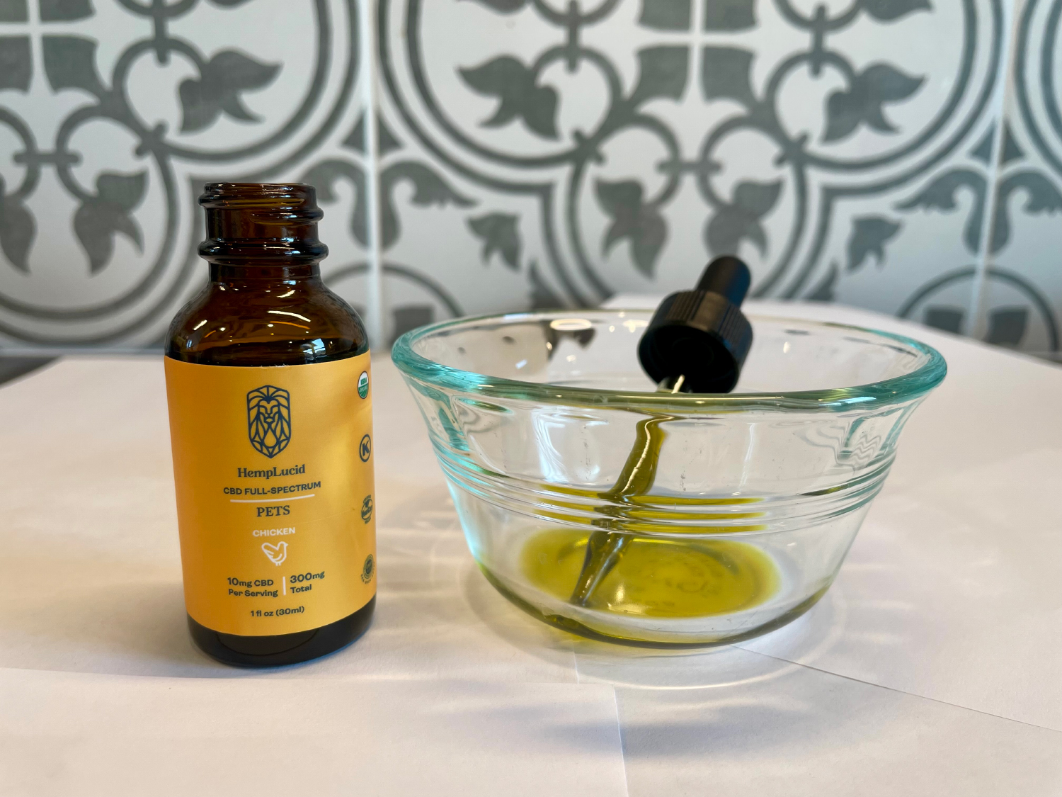 HempLucid Organic Full-Spectrum CBD - tincture bottle and dropper in the bowl